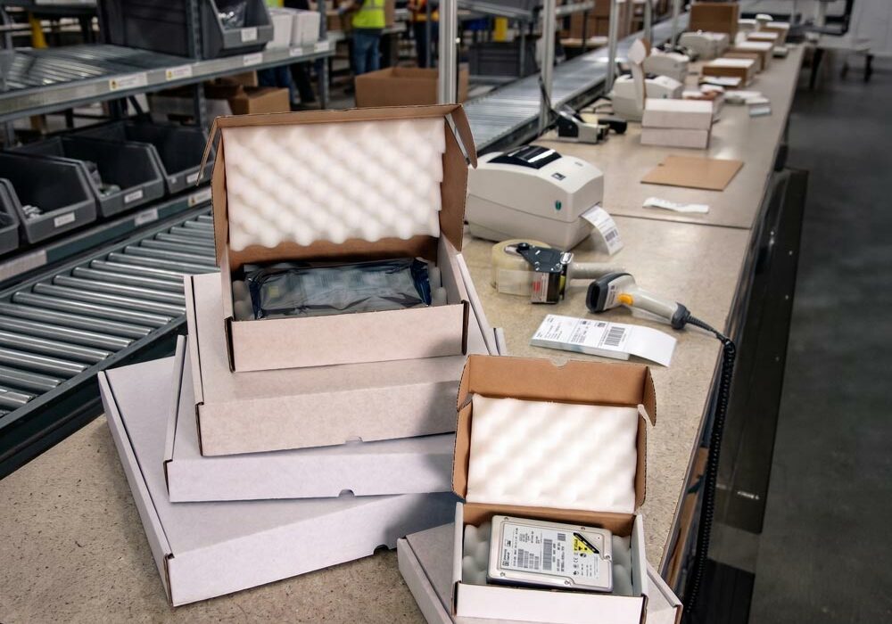 Foam shipping boxes A pile of foam shipping boxes on a workbench in a factory