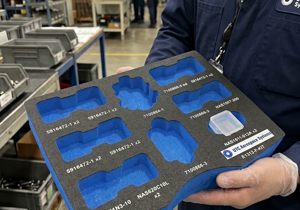 Industrial foam tray A person carrying an industrial foam tray in a factory